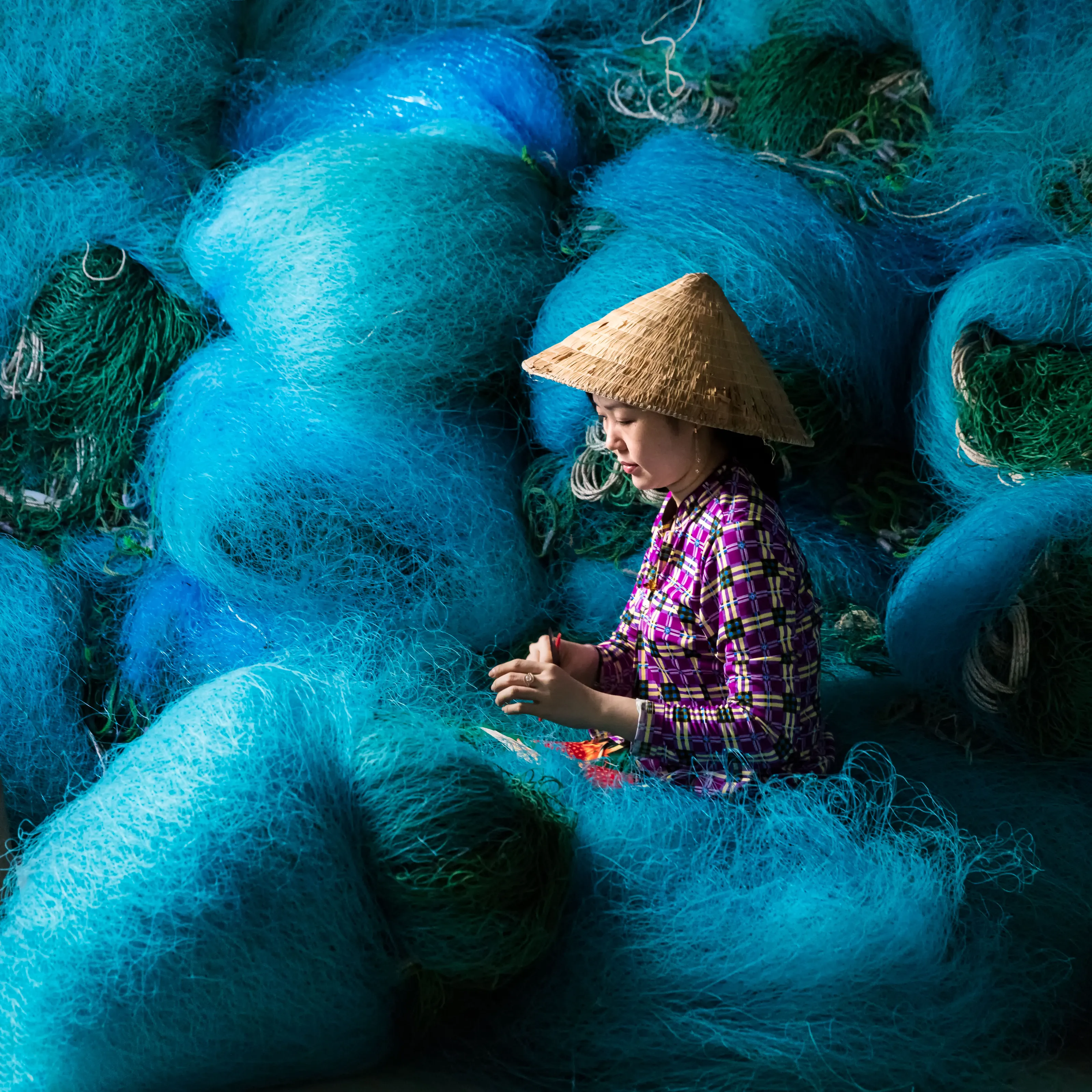Mending fishing nets ...