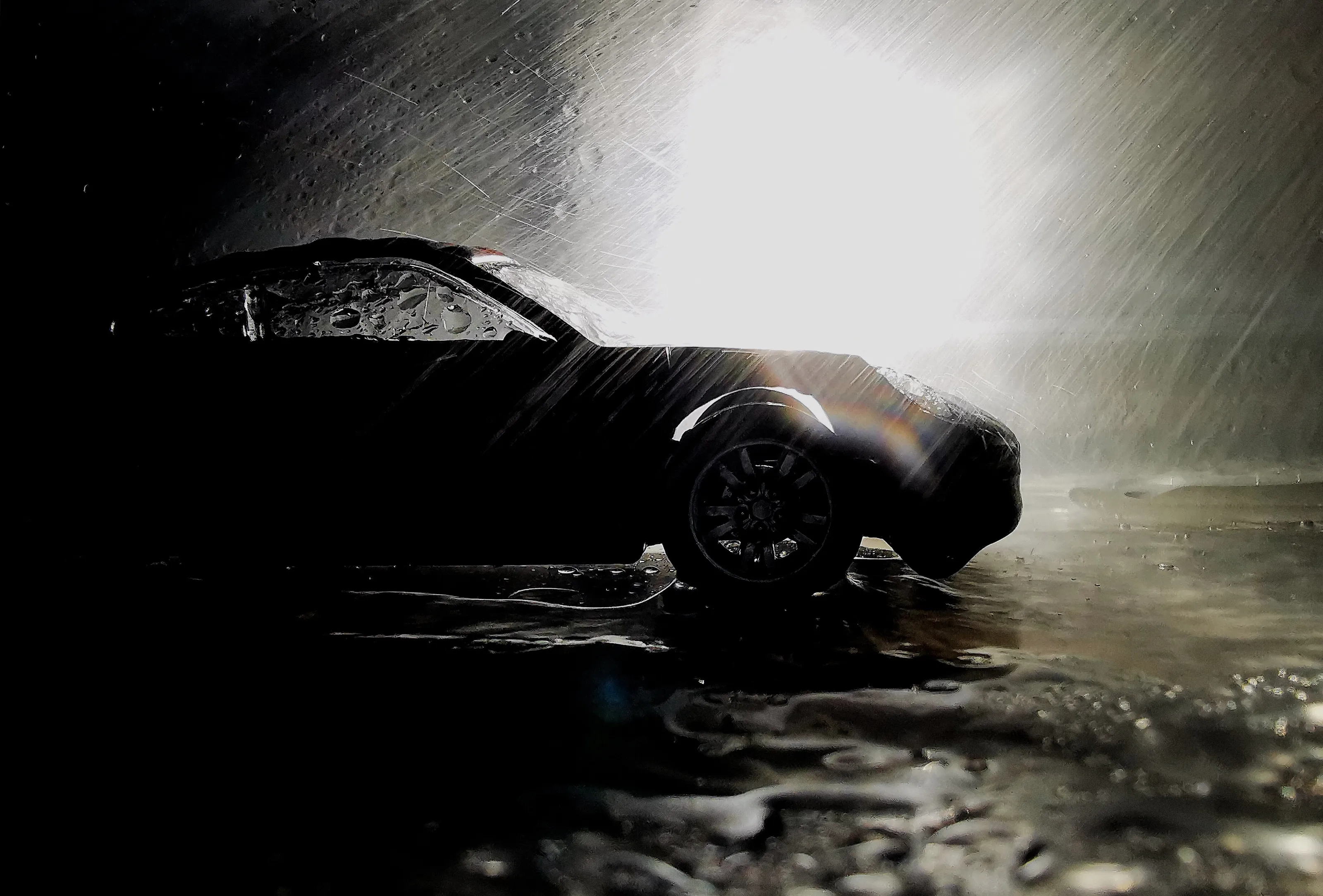 Black car in the night rainy day
