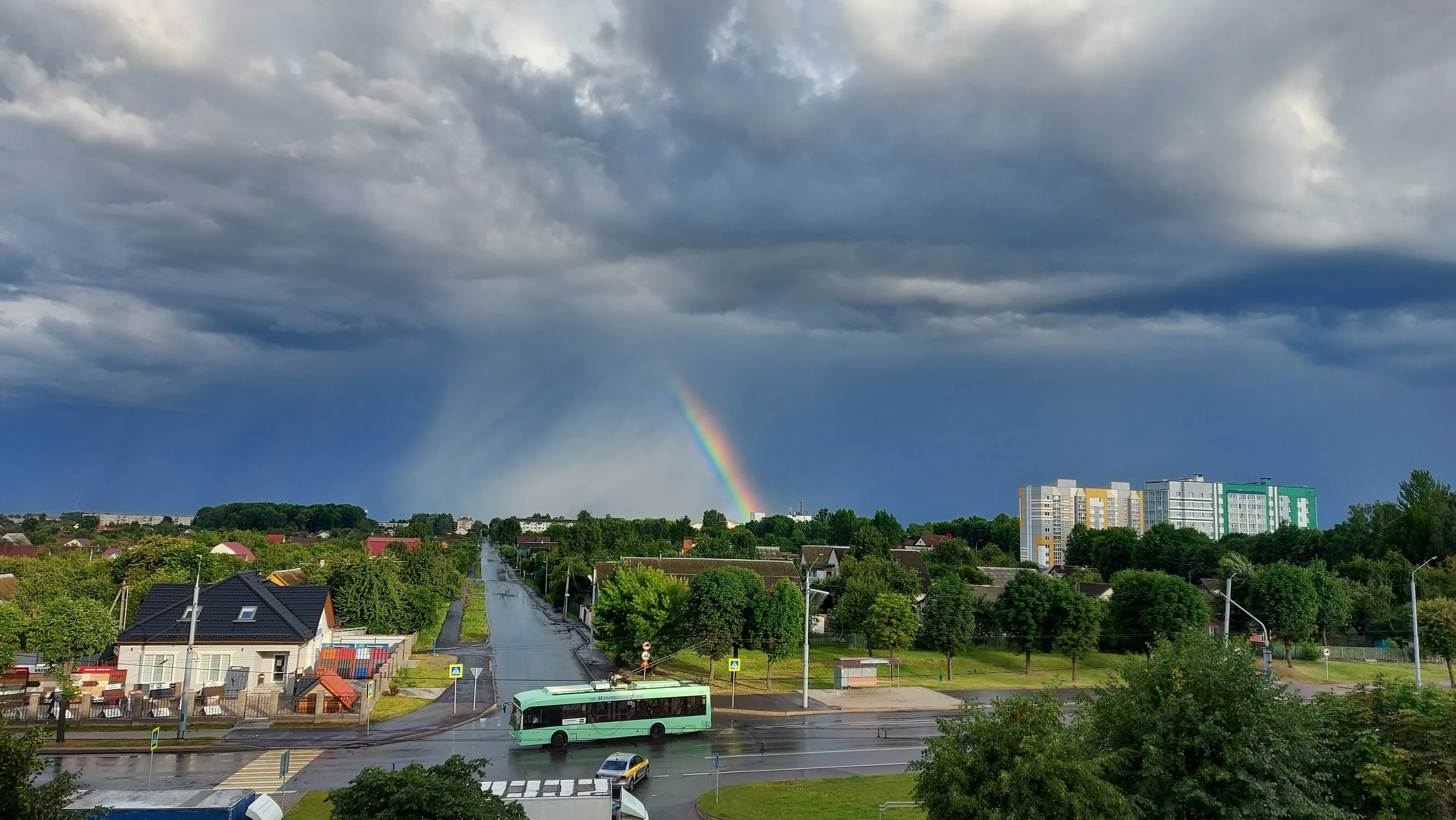 A rainbow over a rain-washed city.