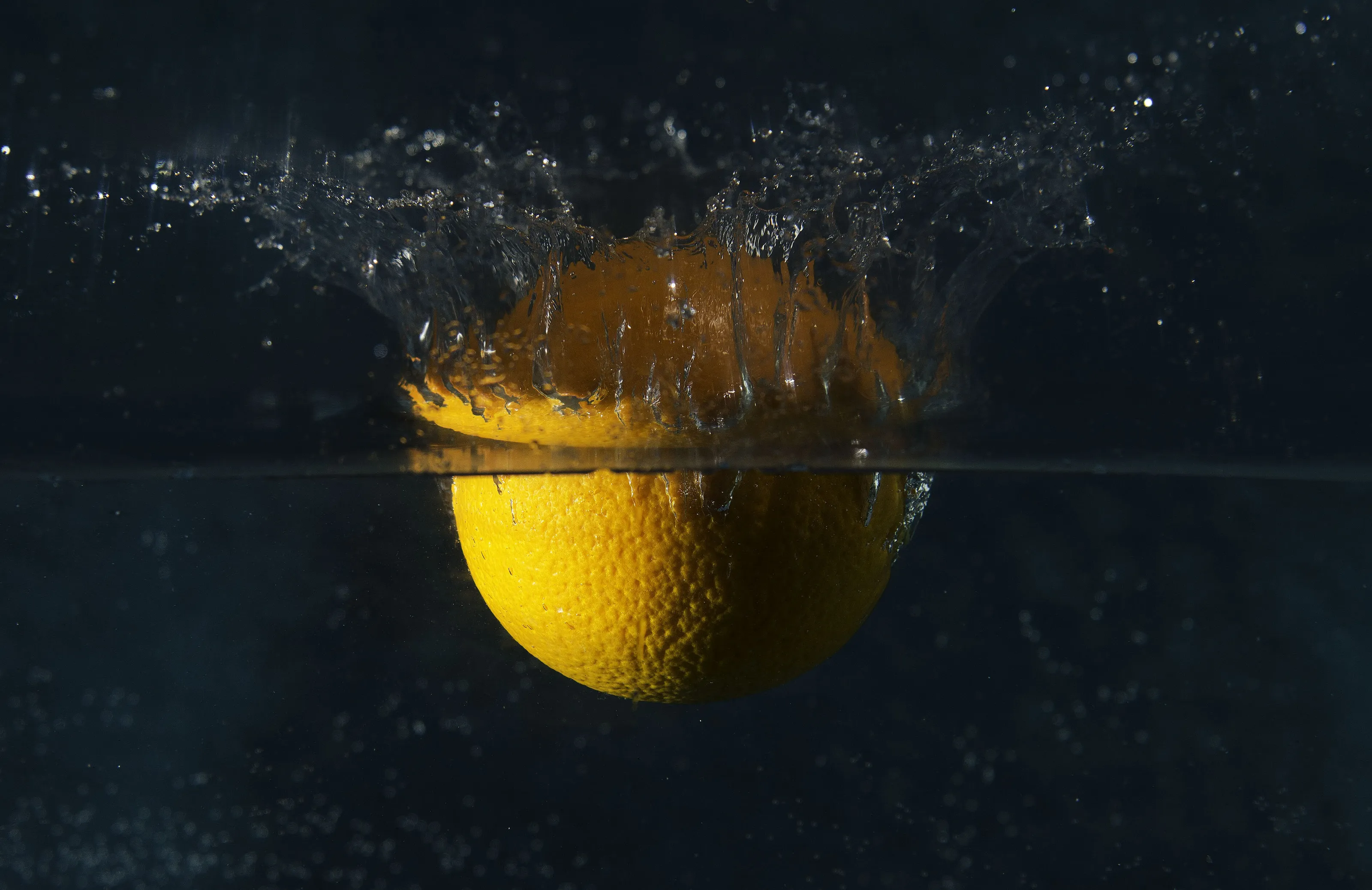 #karlenelaycockphotography #orangefallingintowater #highspeedphotography