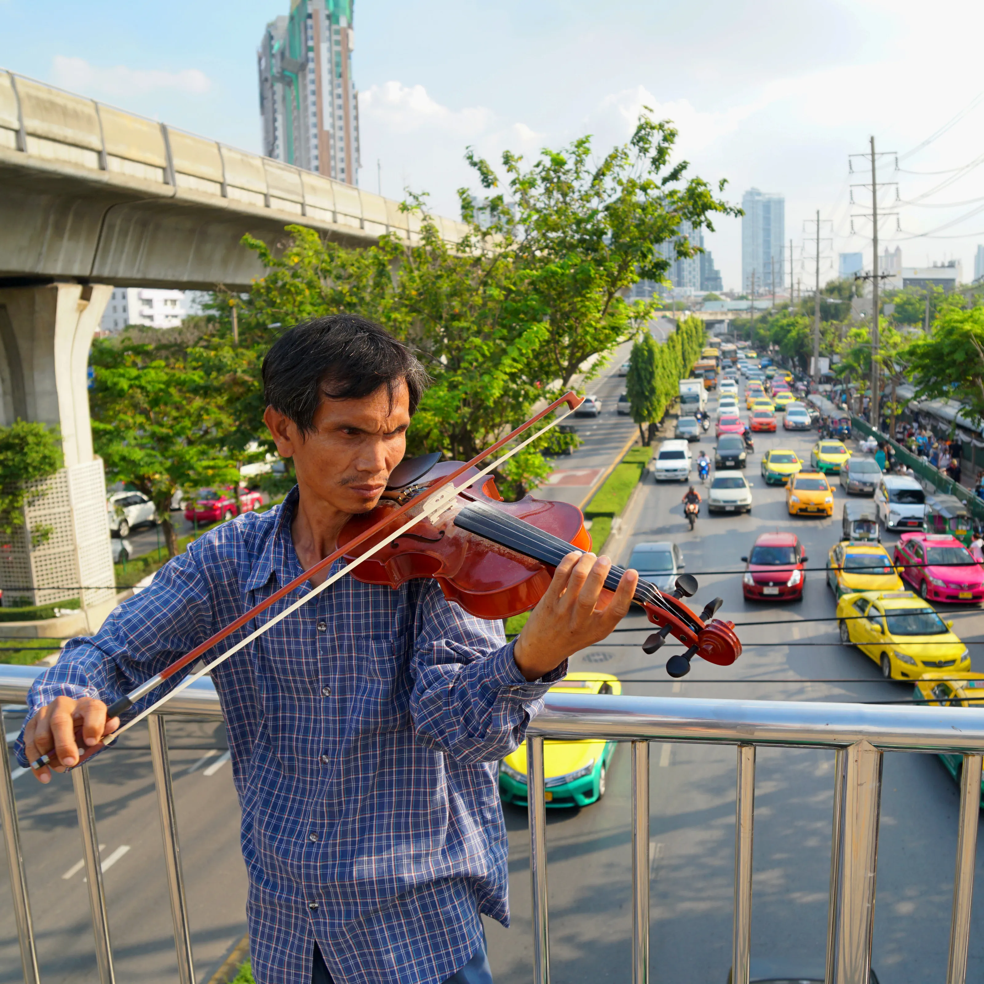Violin Man on Bangkok Bridge