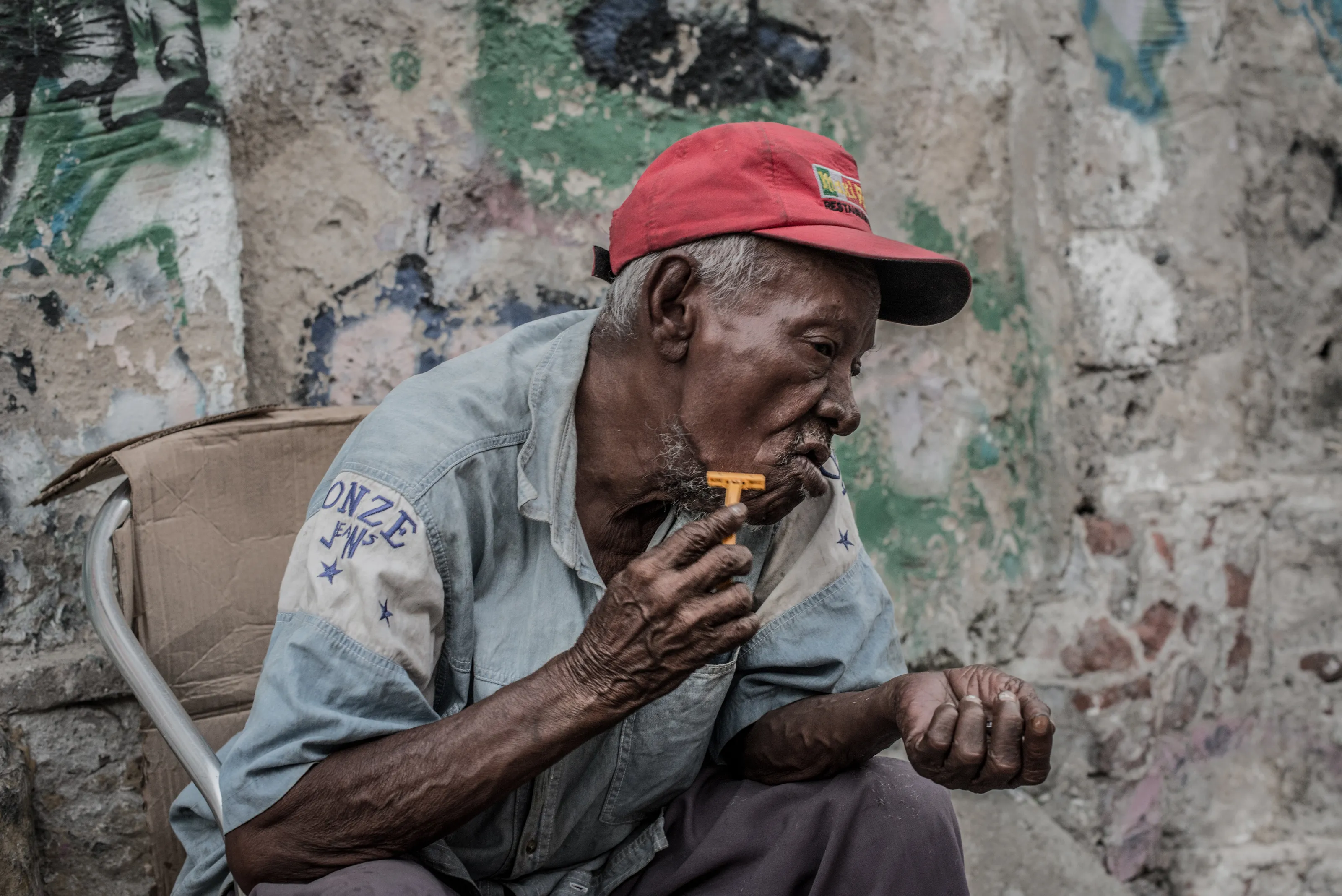 Homeless man shaving