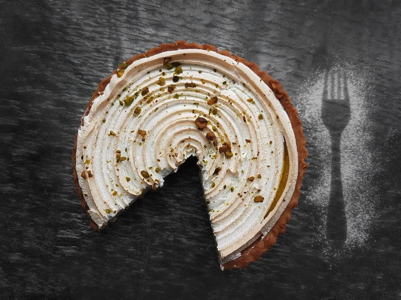 Lemon merengue with fork