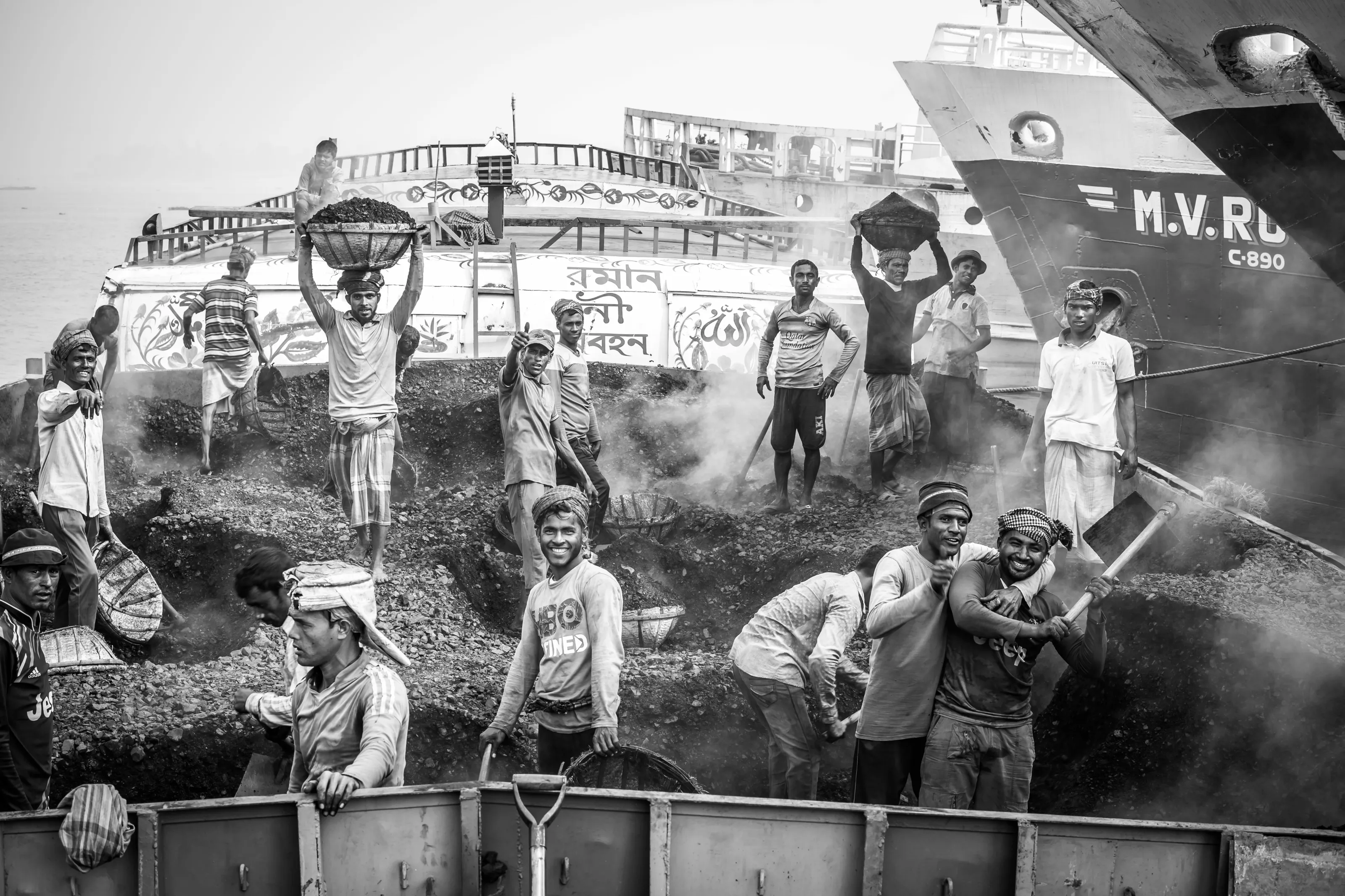 Coal boat with labourers