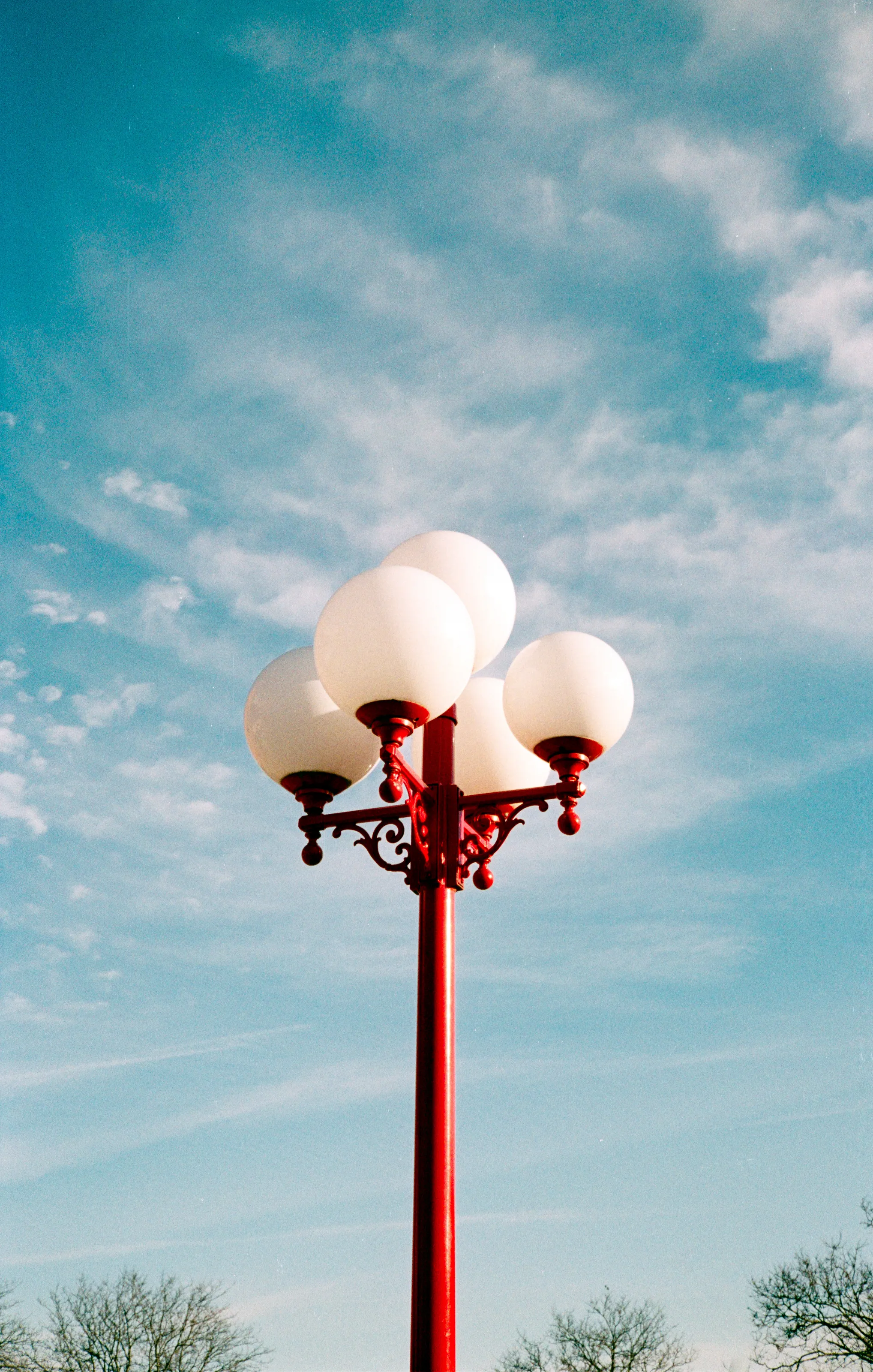 Red Street Lamp in Blue Sky