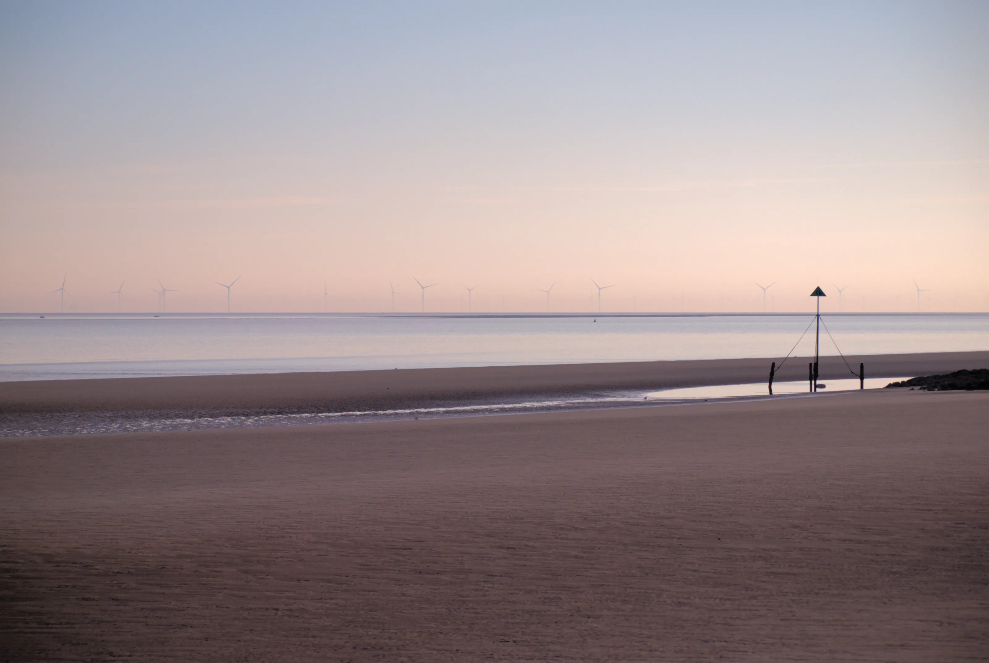 Off-shore wind turbines at dawn from Prestatyn Beach.