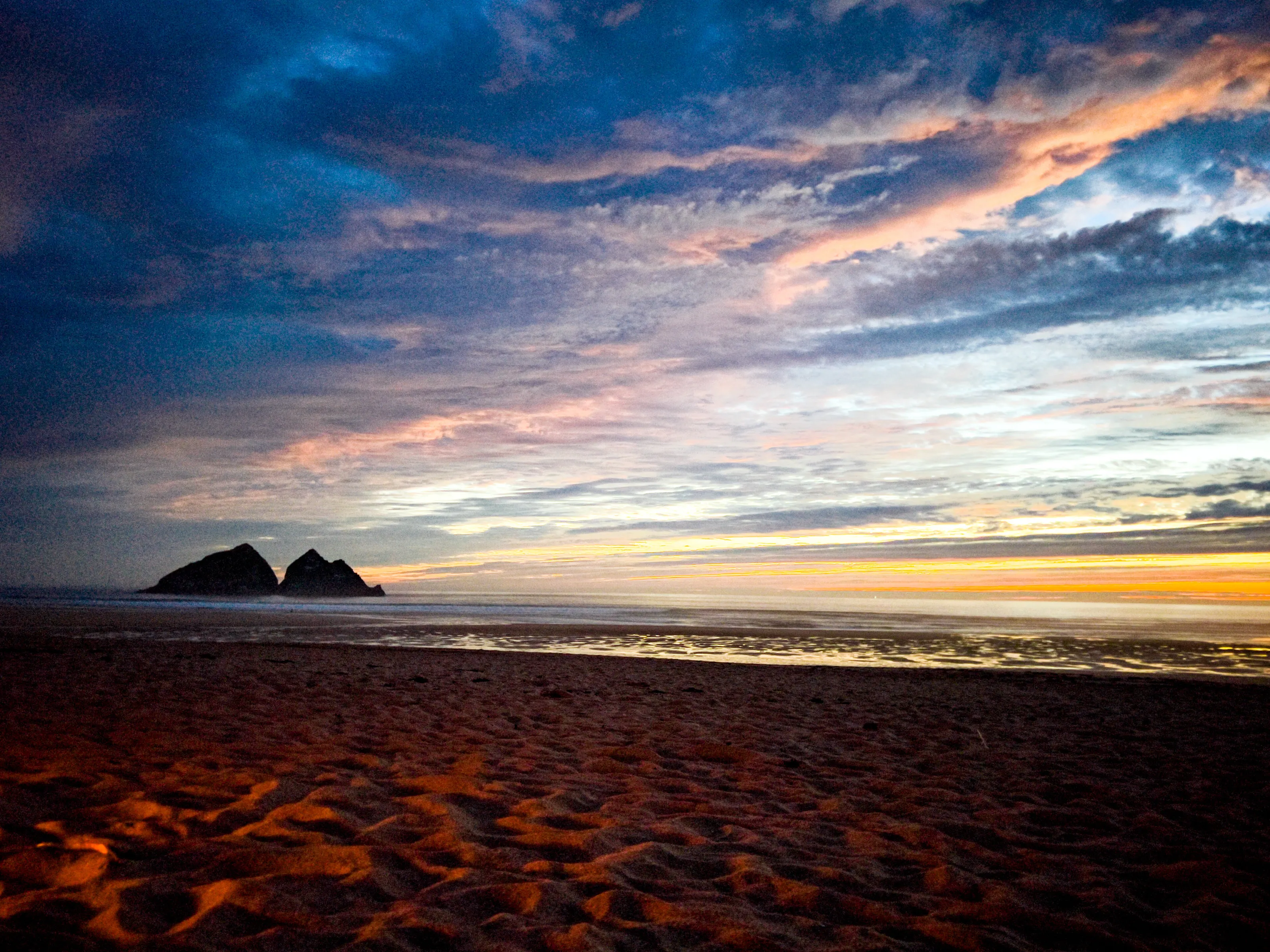 Magical view of the ocean under a blue & orange sky