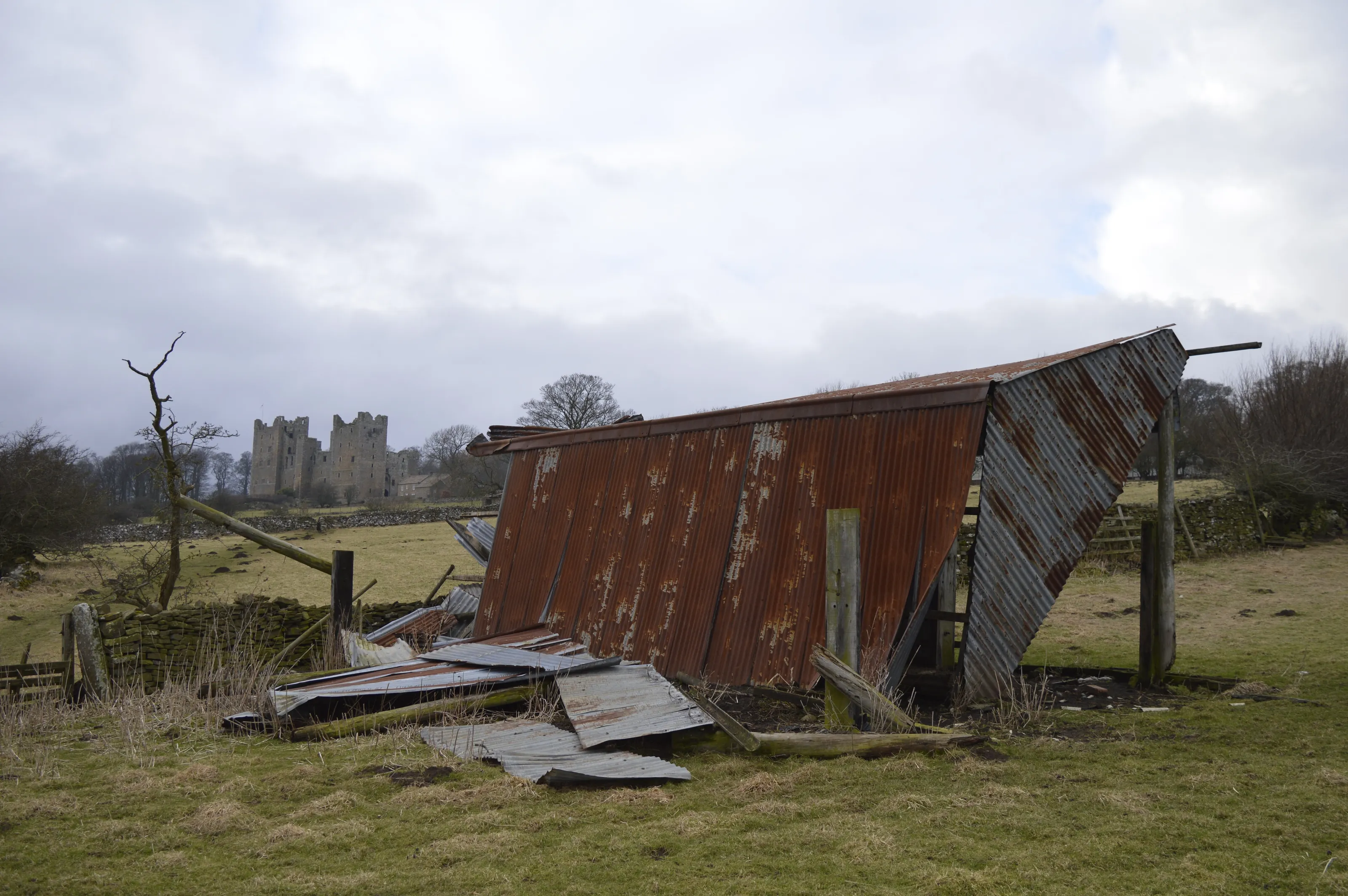 storm damaged rusty barn