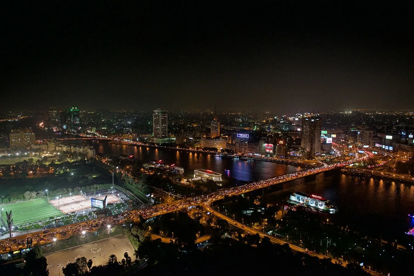 Cairo At Night With Nile River .