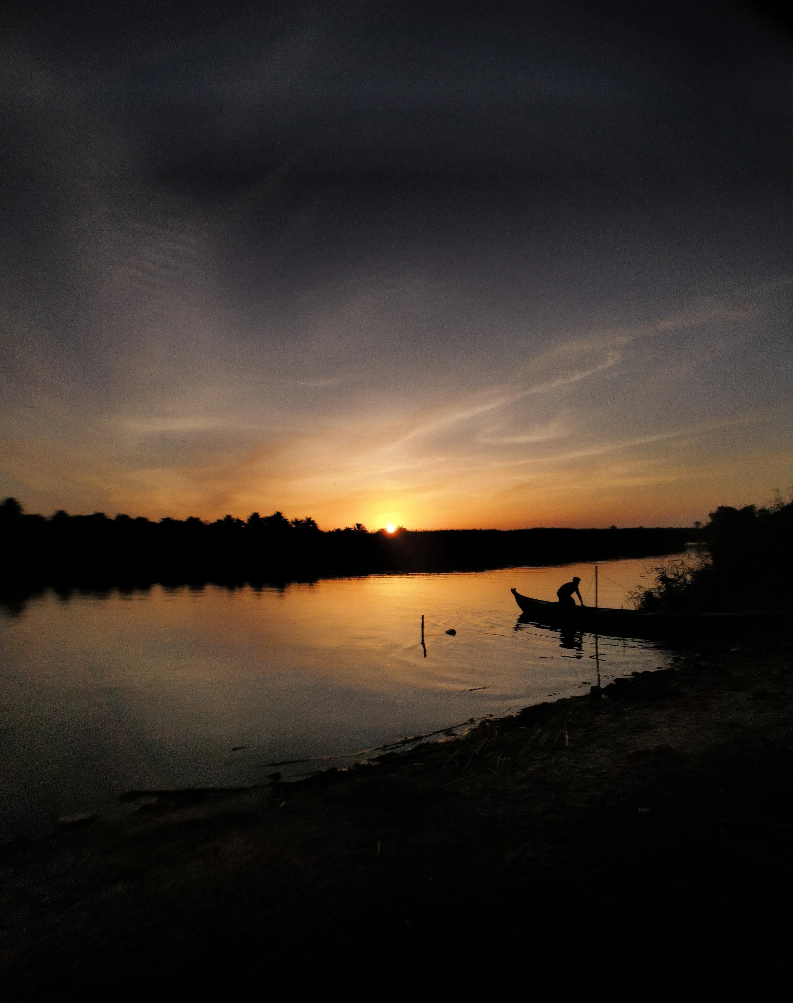 A fisherman casting a net