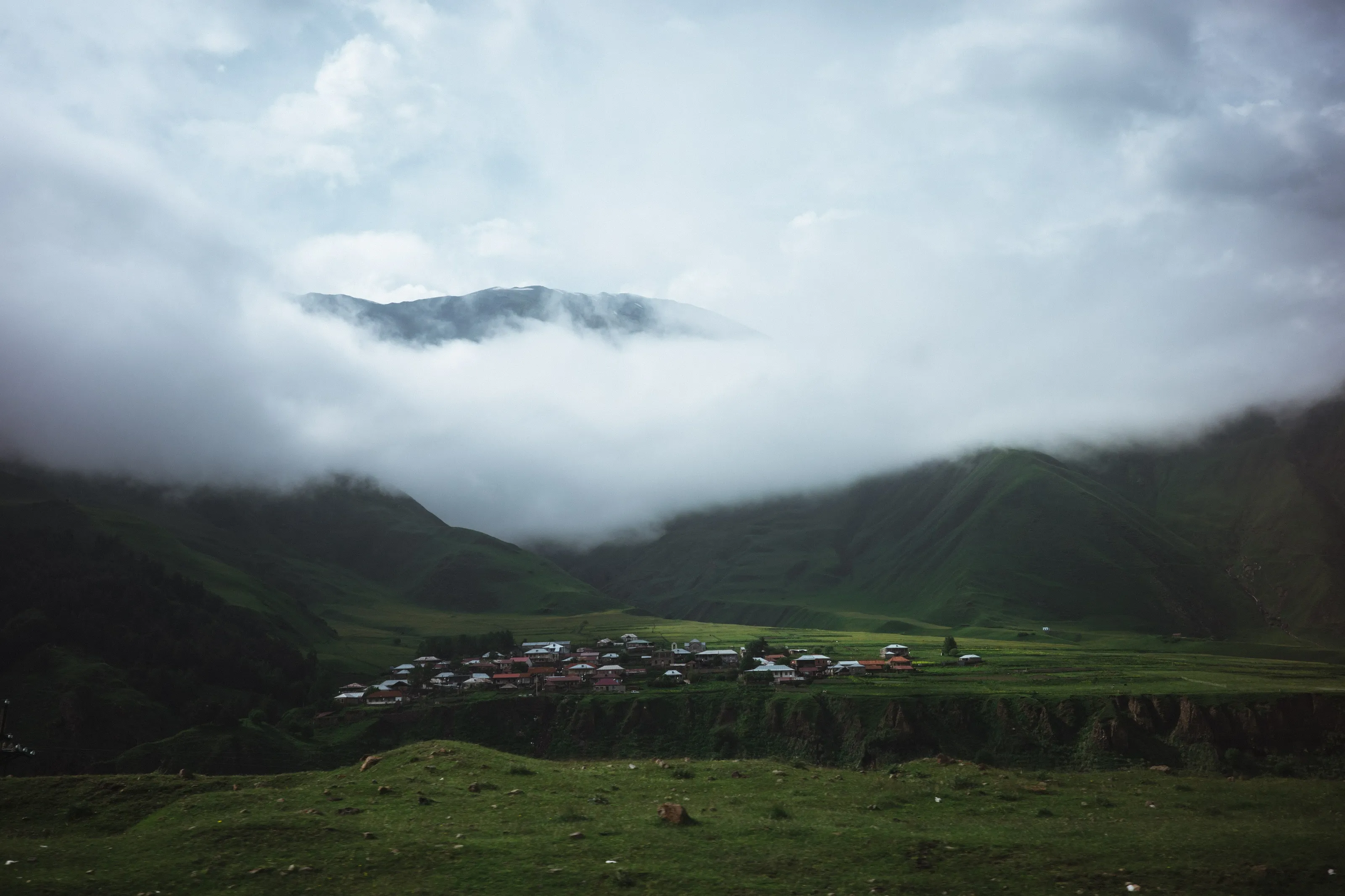 Georgian village on a cliff in mountains