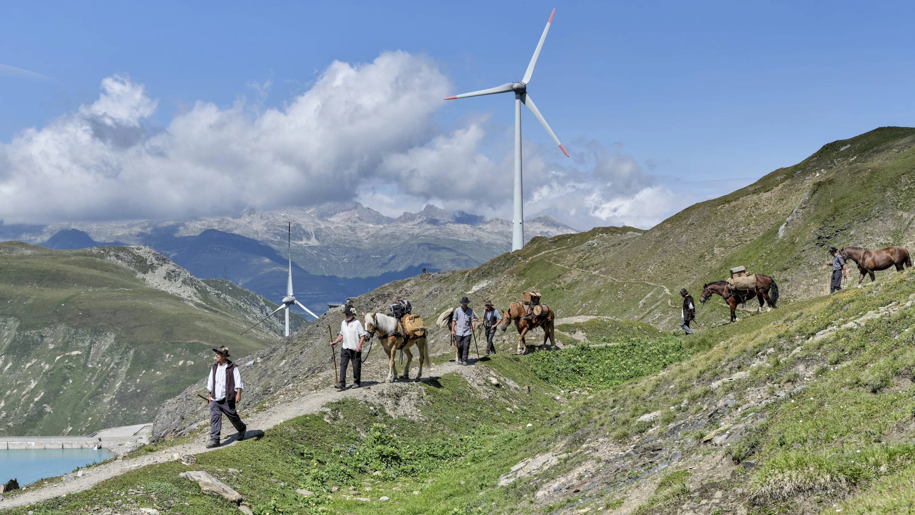 Muleteers in front of wind turbines