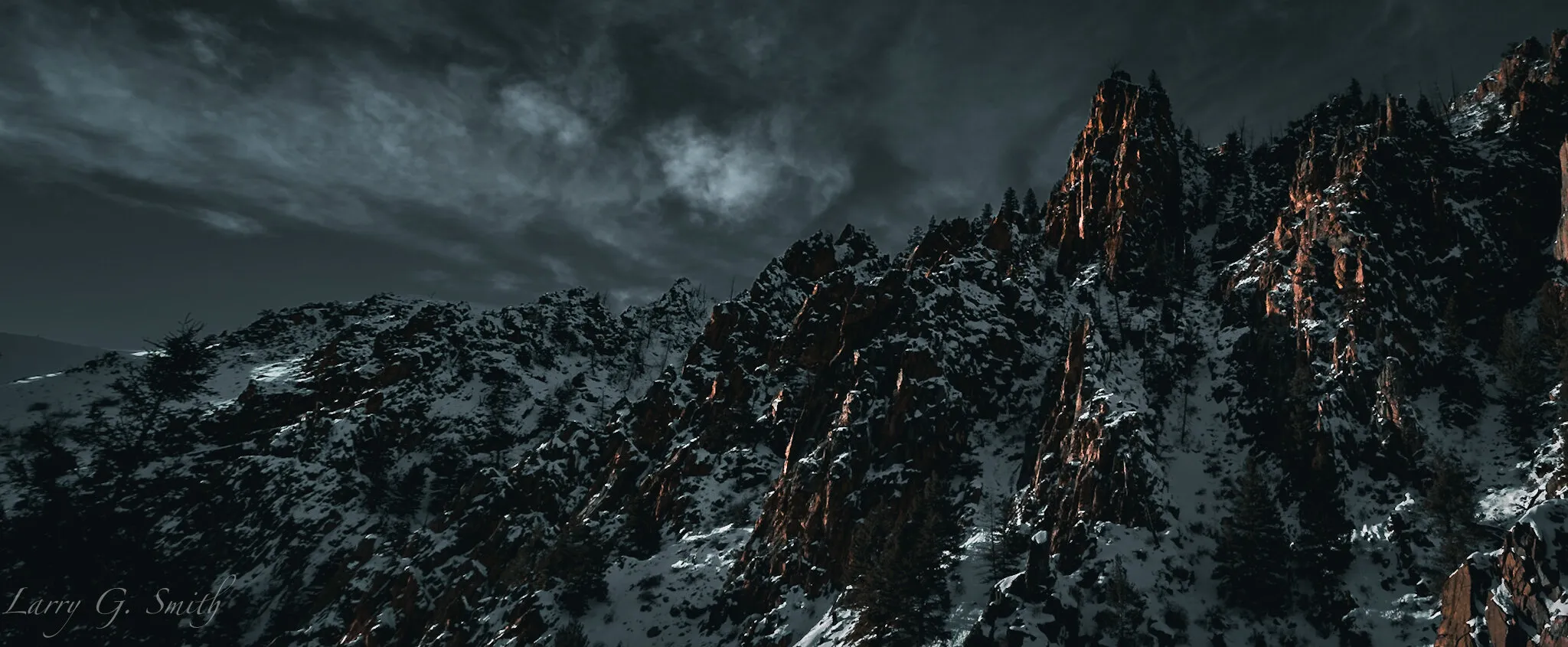 The Contrast of Snow and Stone: A Sunset View of a Monolithic Canyon