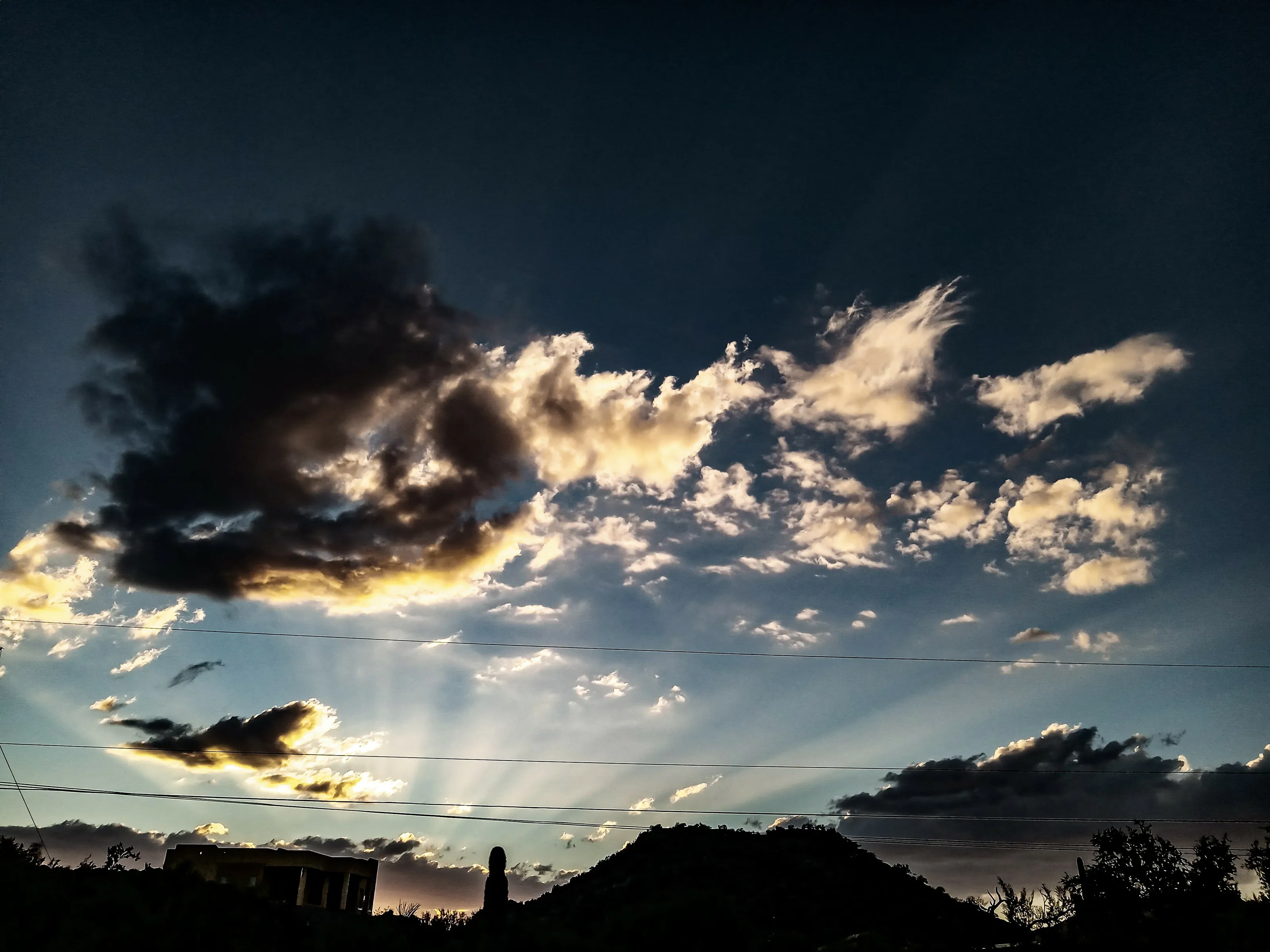 Sunset illuminating the cloudy desert sky in Arizona