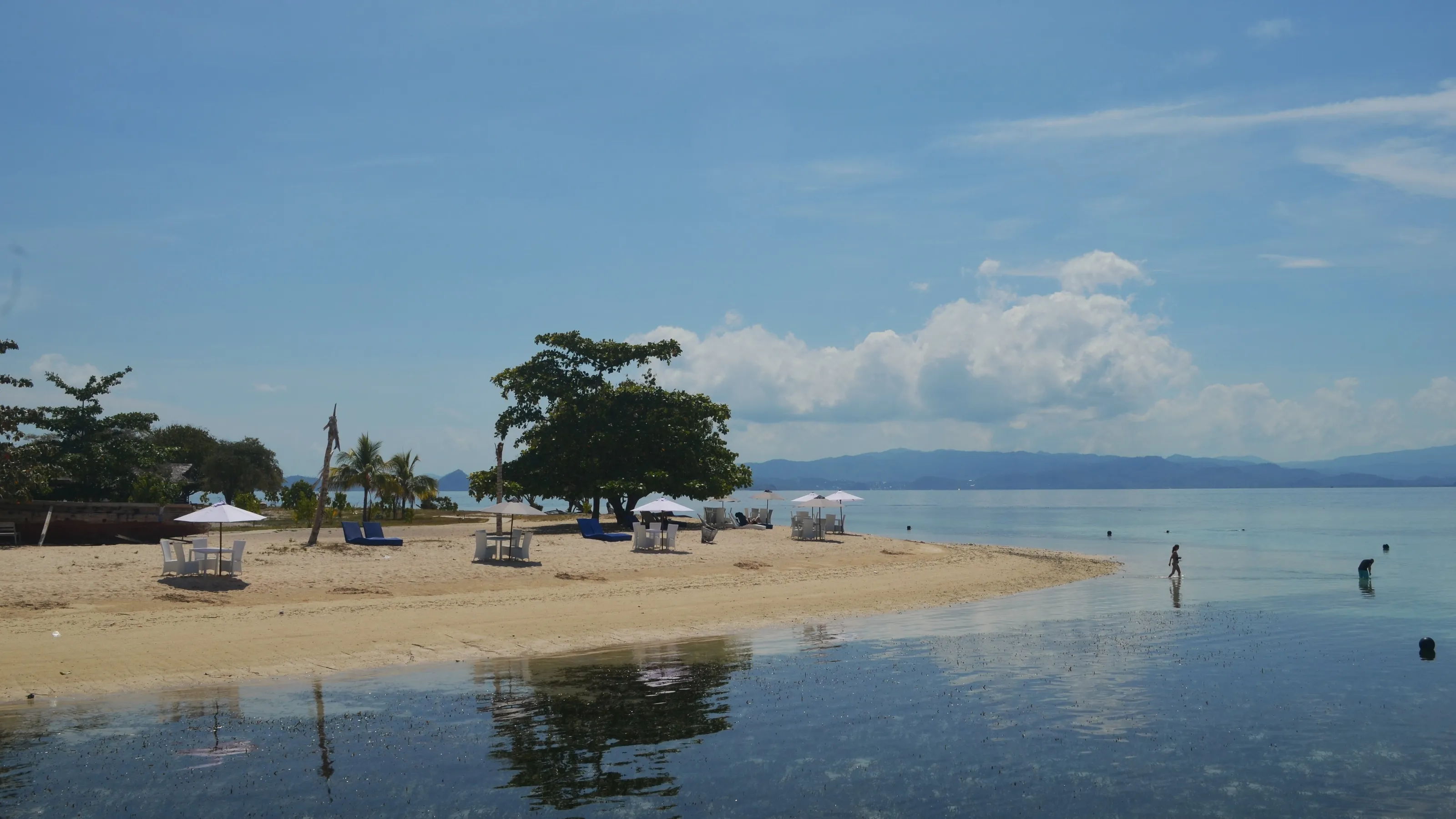 White sand beach againt clear vlue sky