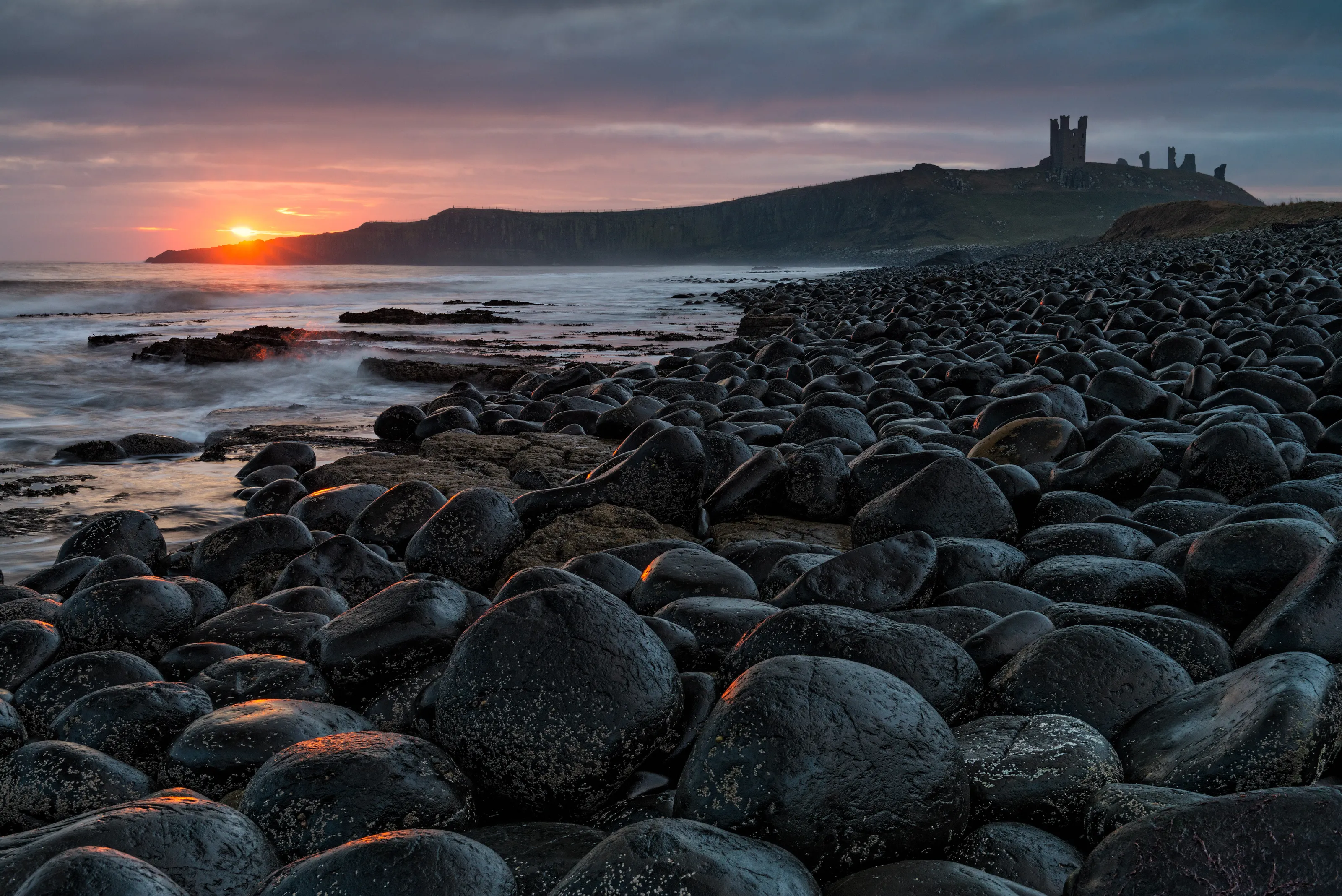 Embleton Beach and Dunstanburgh Castle at Sunrise