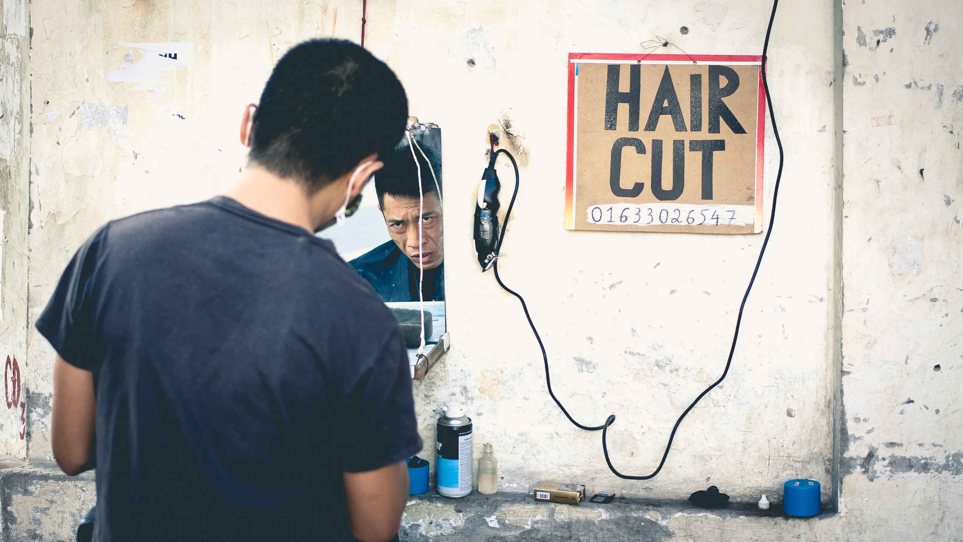 Street corner barbershop. Hanoi.