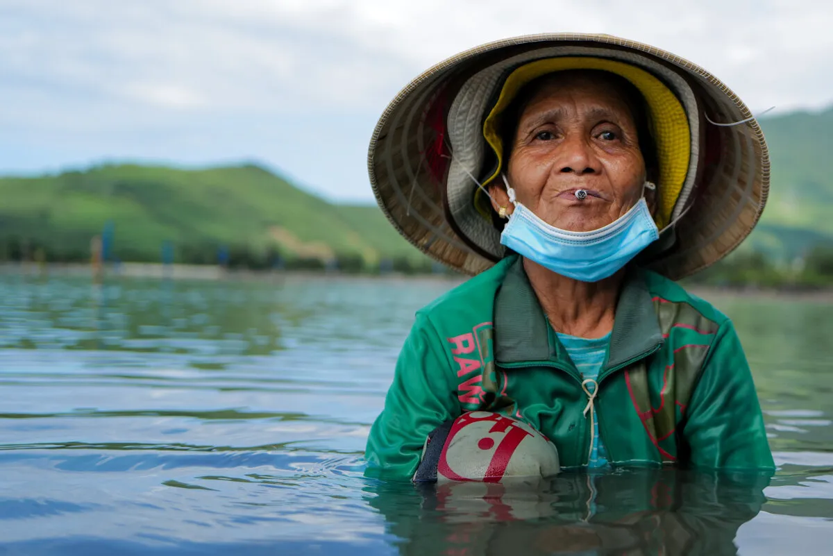 Portrait of a Vietnamese Woman Harvesting Oysters