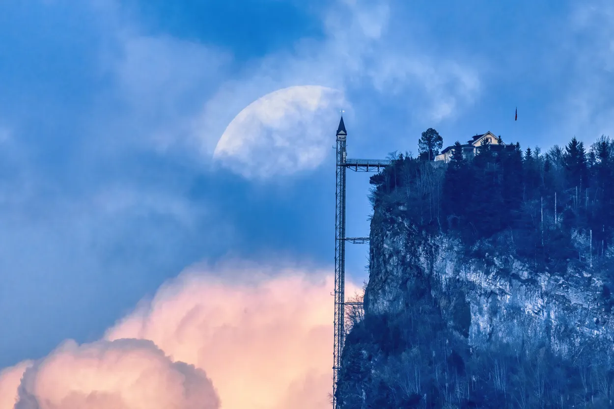 Part of Full Moon rising behind Hammetschwand-Elevator