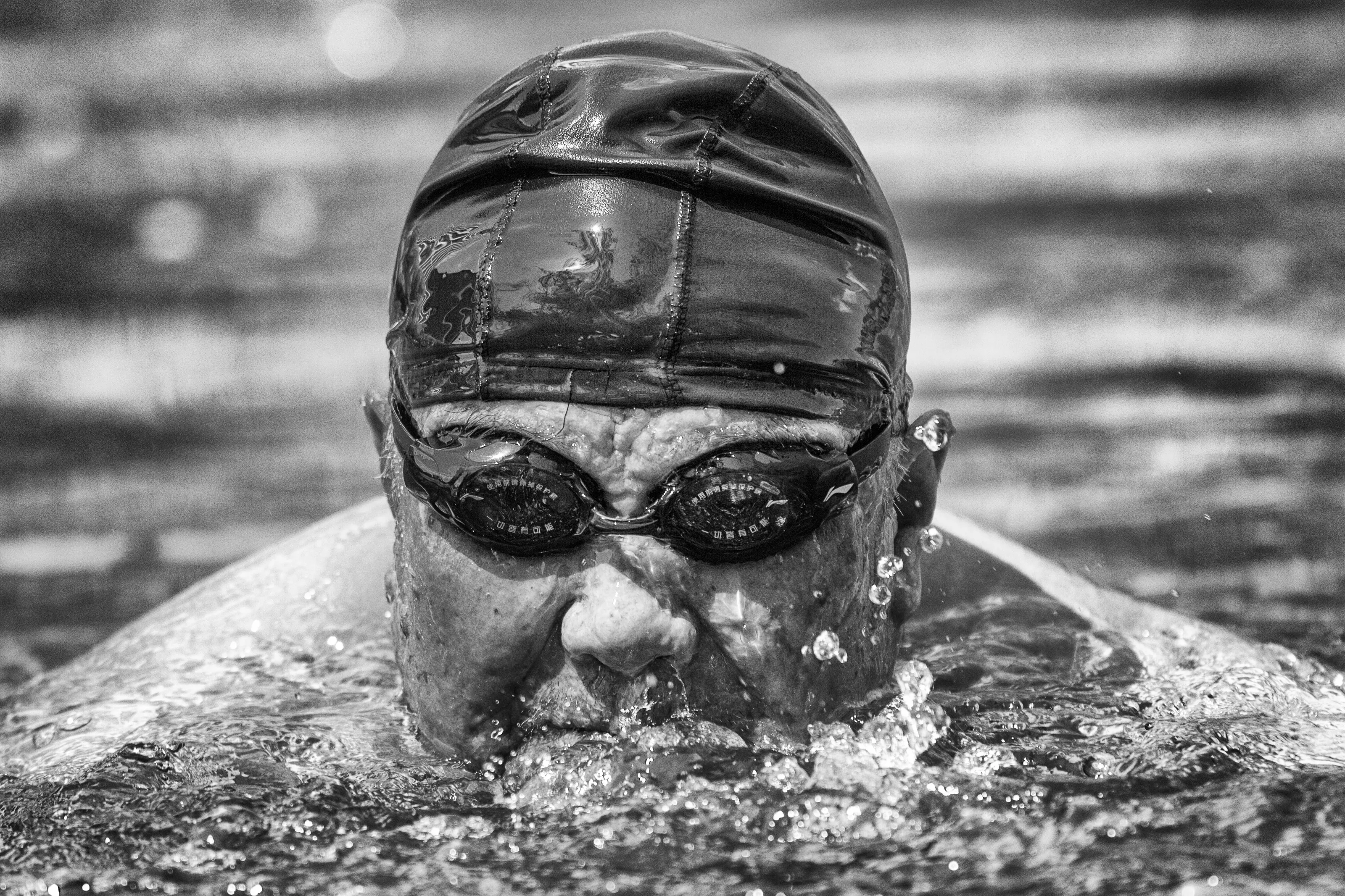 A retiree enjoying a swim in the Liangma river in Beijing (China)
