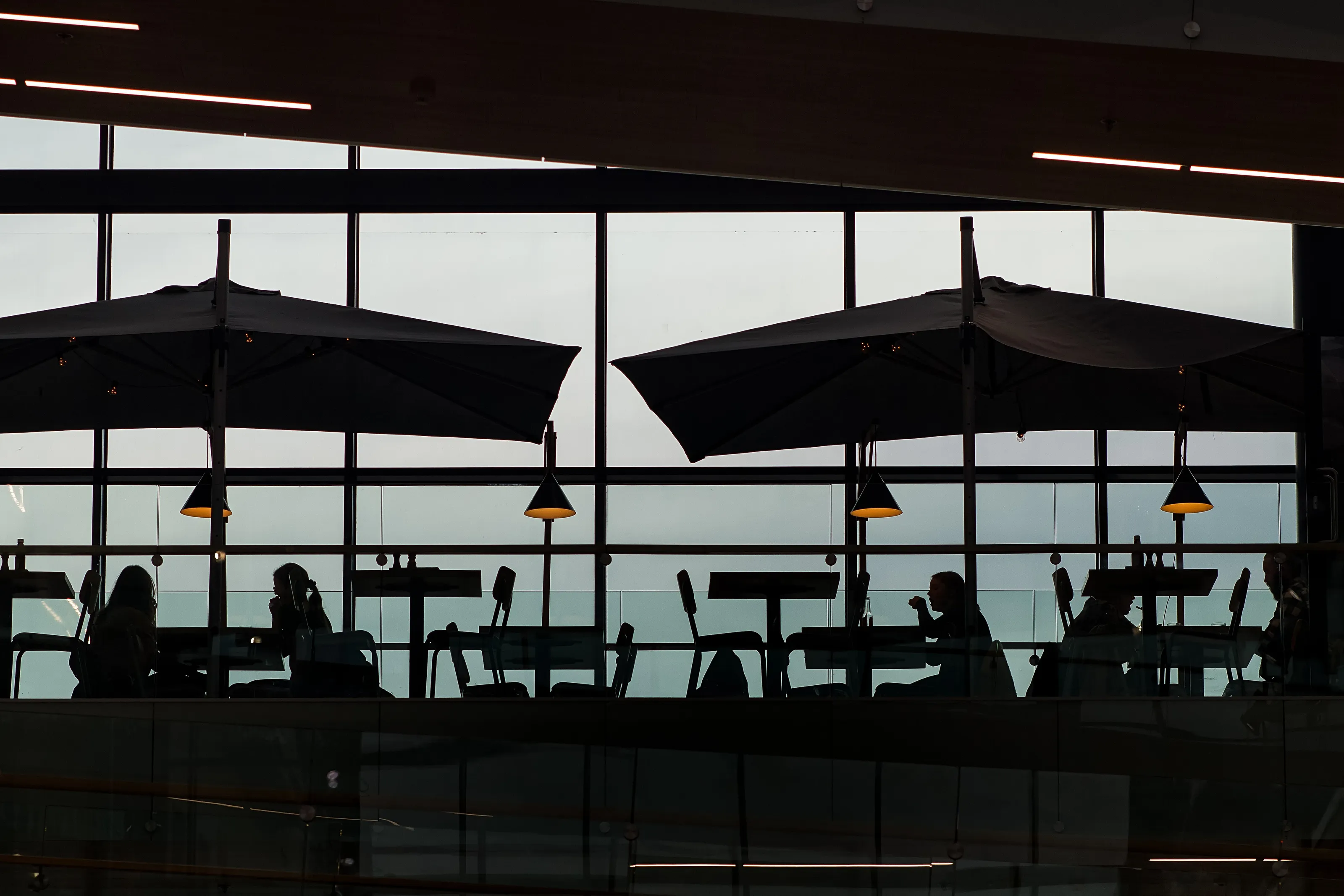 Silhouettes In A Shopping Center