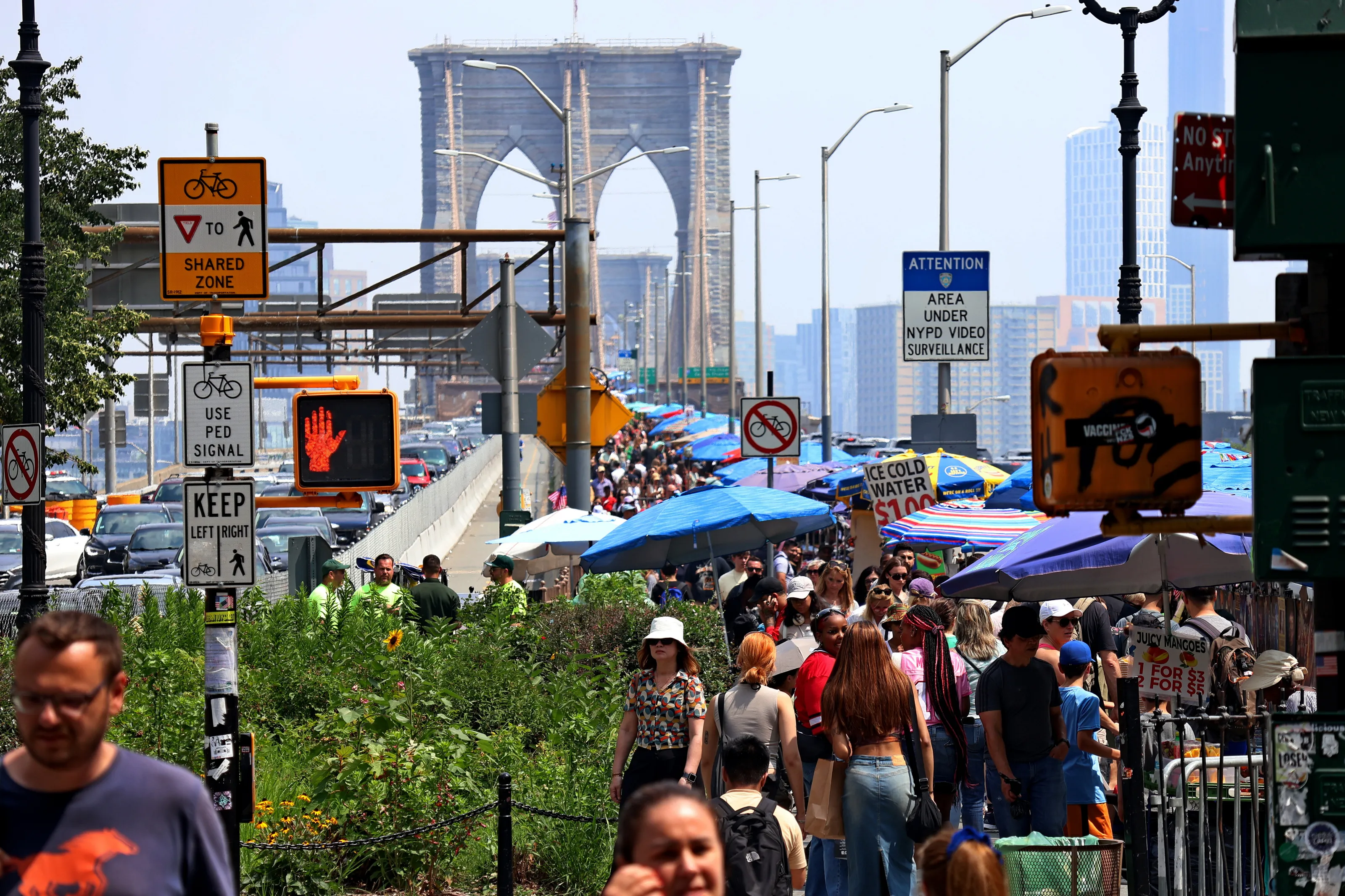 A street market at the foot of the Brooklyn Bridge