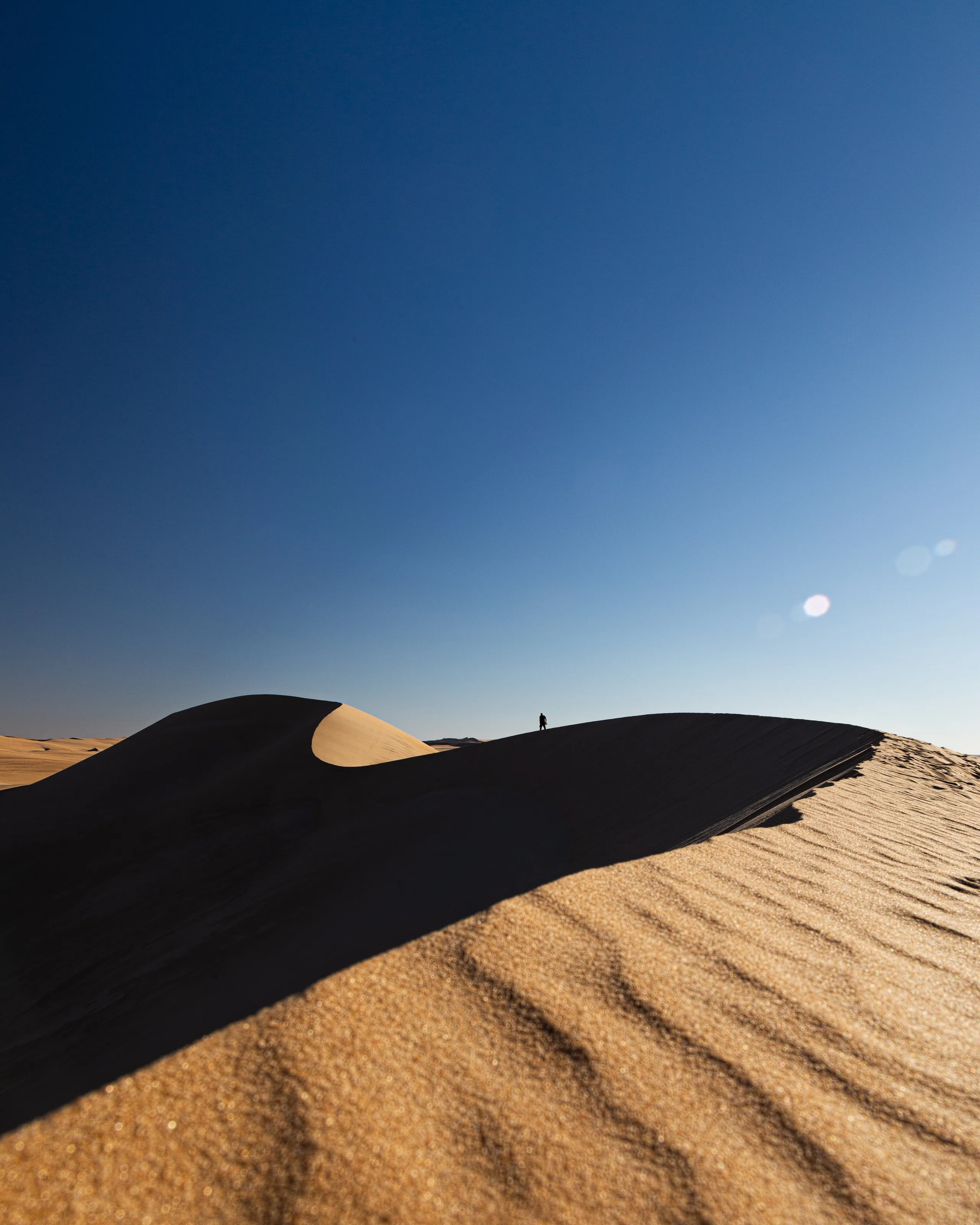 Man with sand dunes