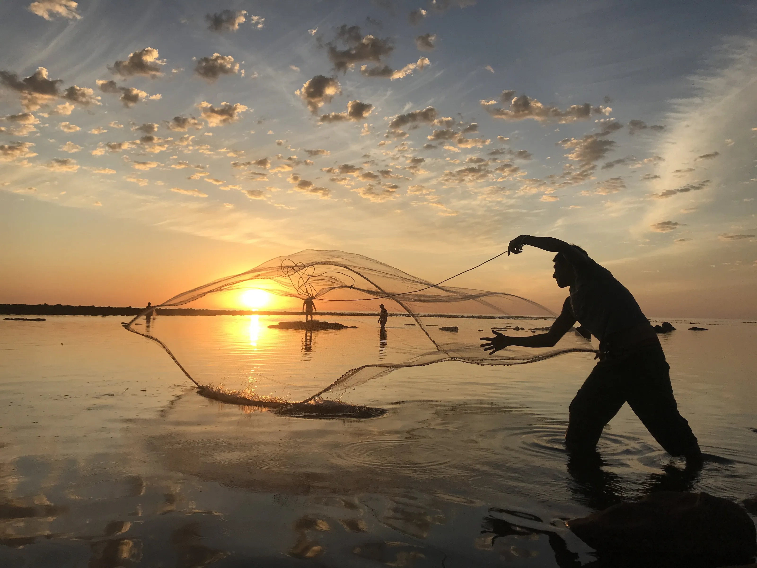 Fisherman catching the sun,Kommetjie.South Africa