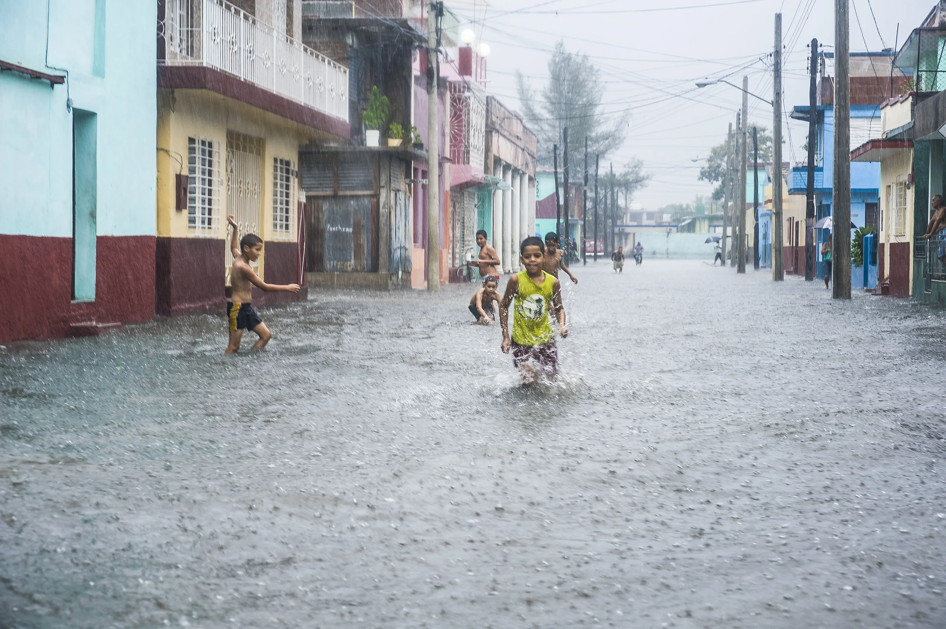 Playing in the downpour - Bayamo, Cuba