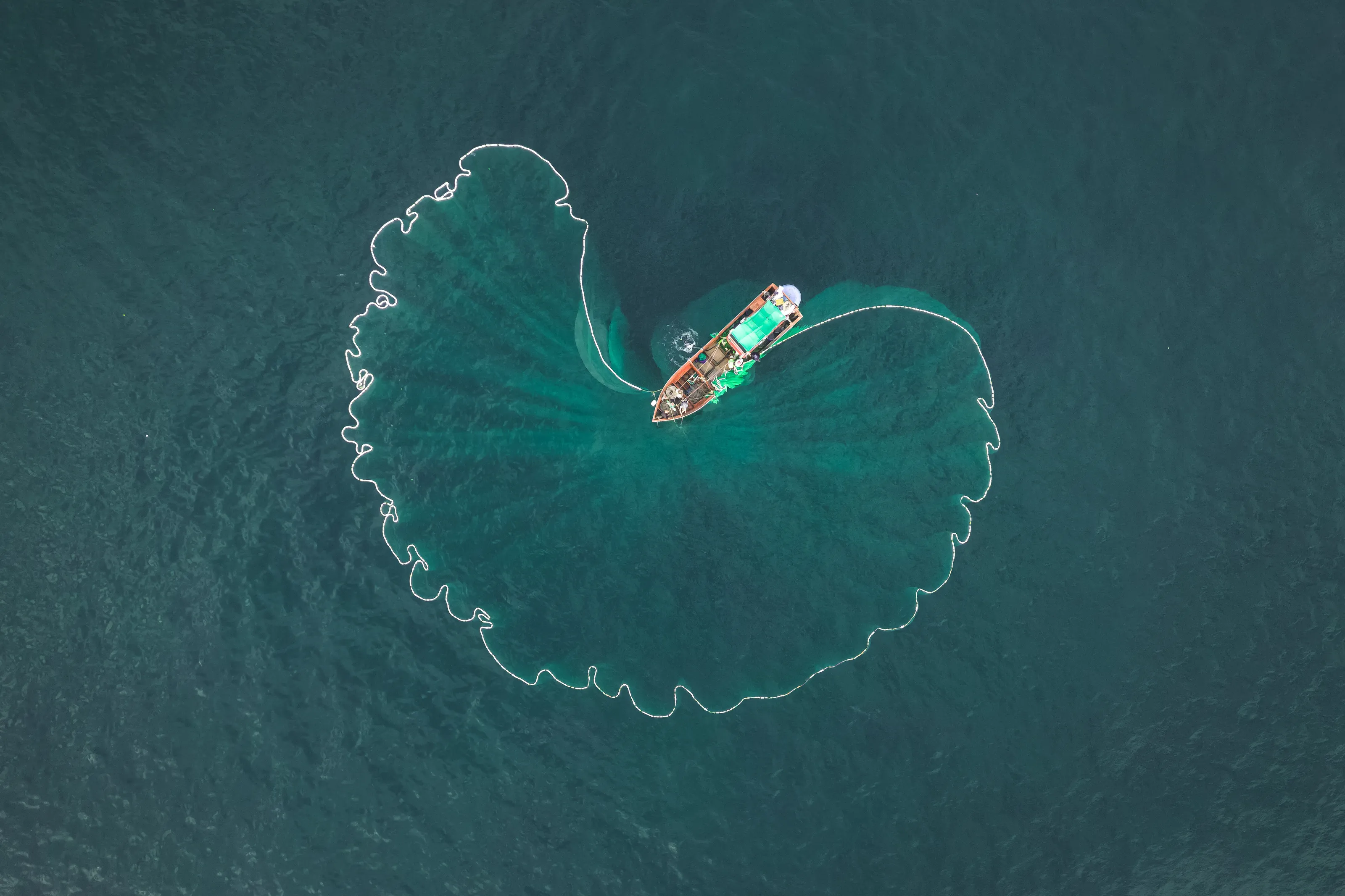 Boats dropping fishing nets