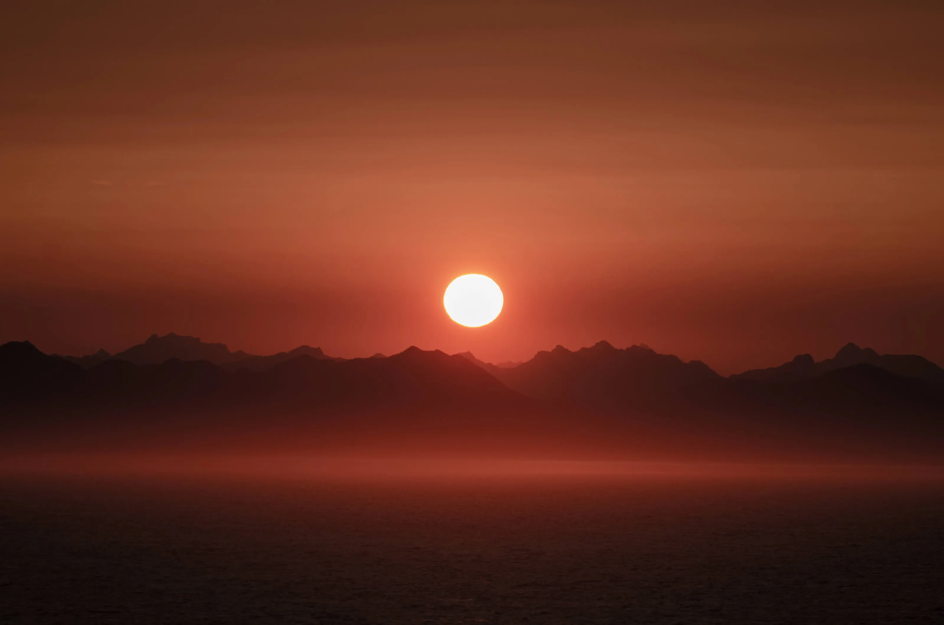 The rising, red sun
