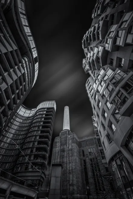 Looking up towards the Battersea power station Chimney black and white architecture photography