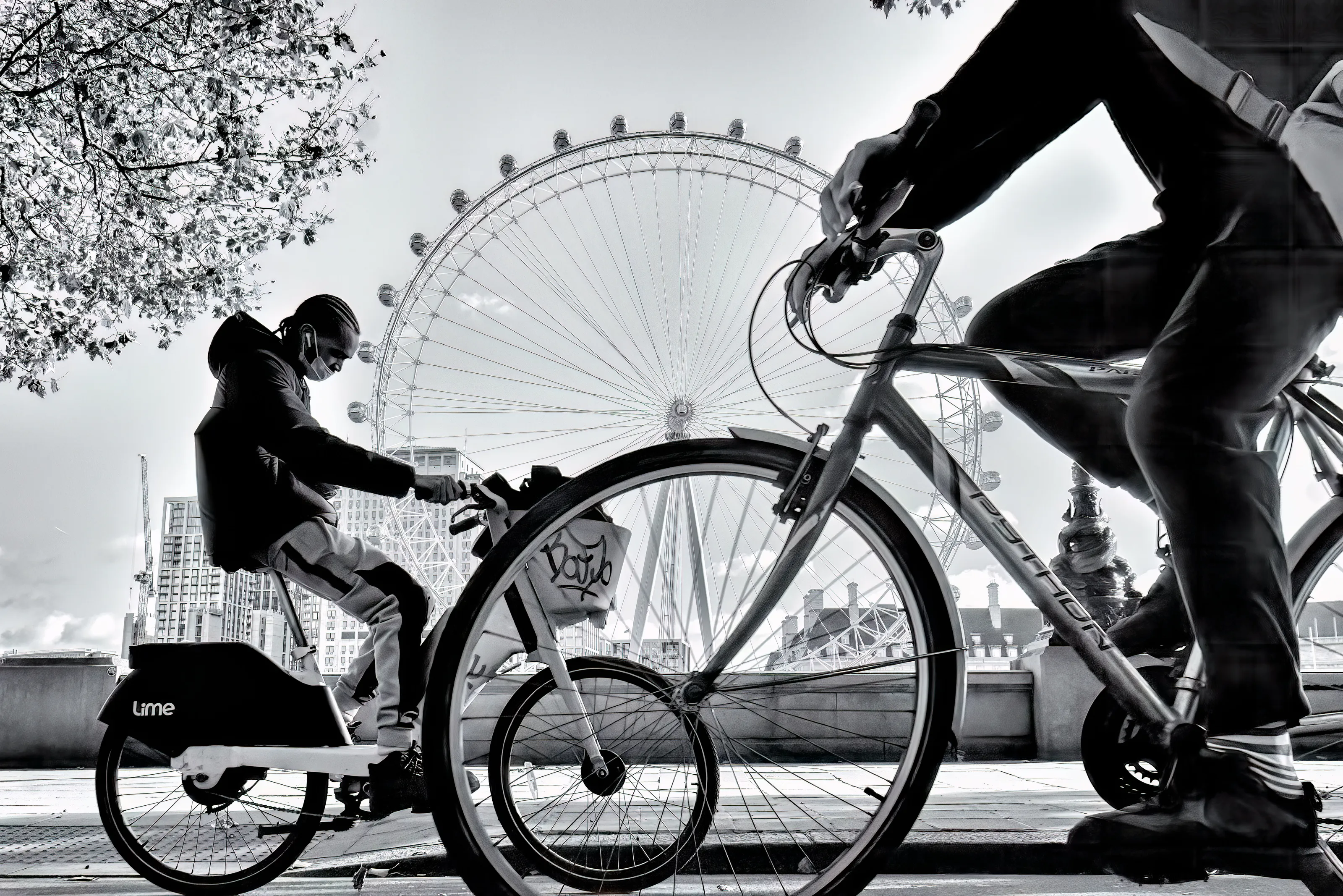 Lots of wheels and the London Eye street photography black and white