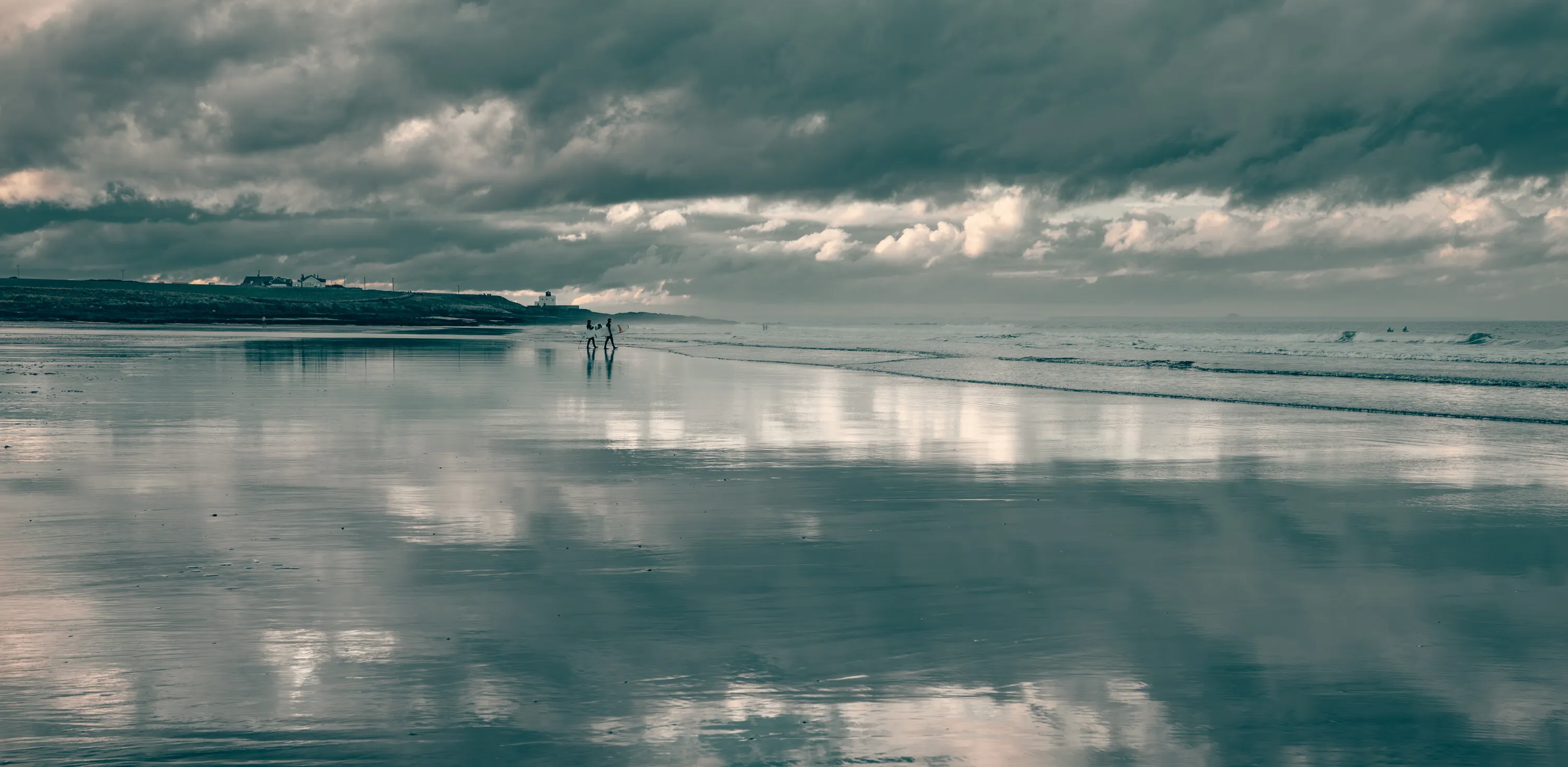 Surfers and reflections