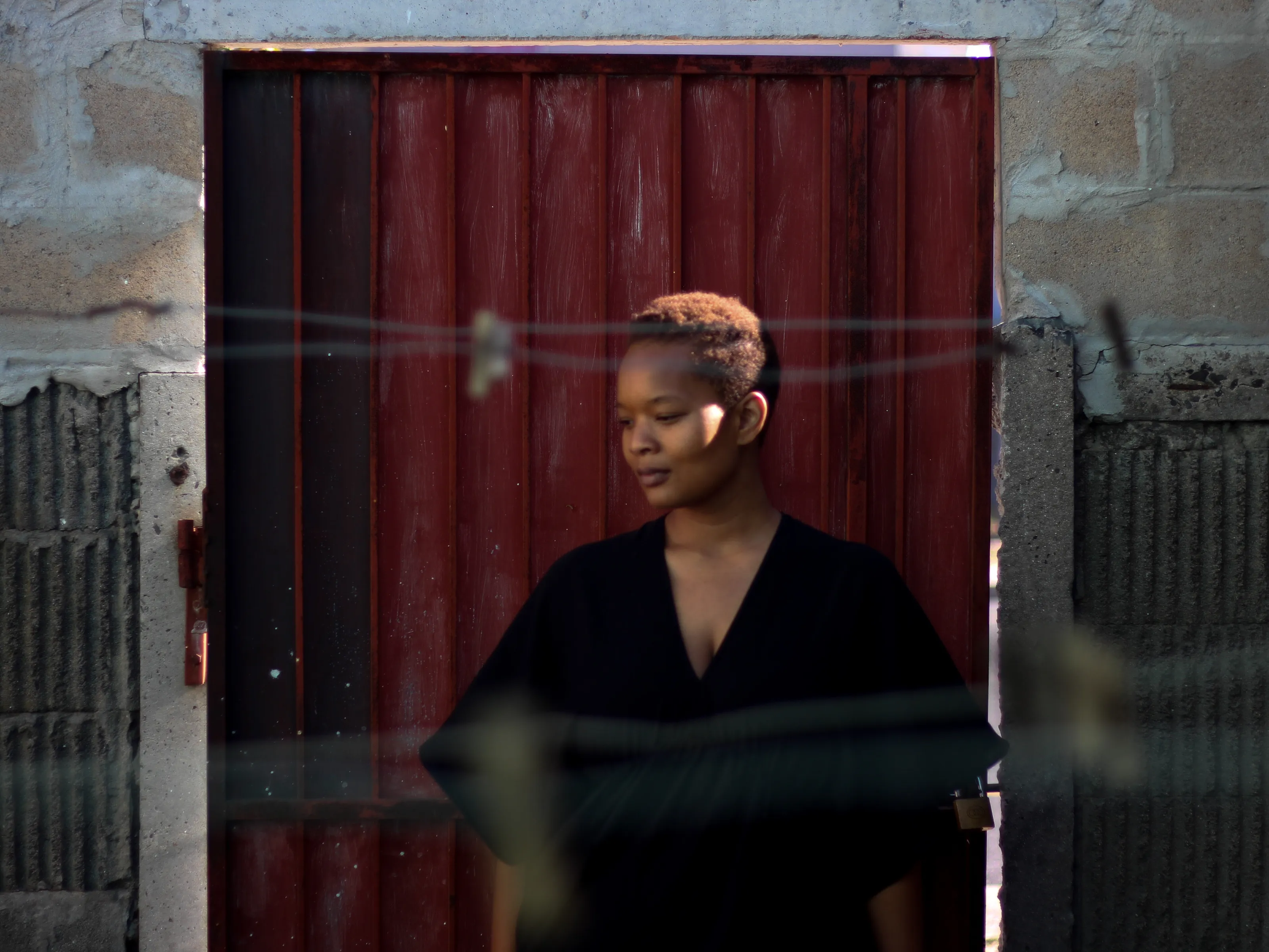 The lady behind the red door