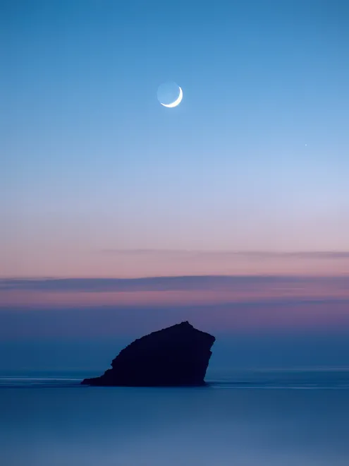 Under the crescent moon at Portreath Cornwall UK