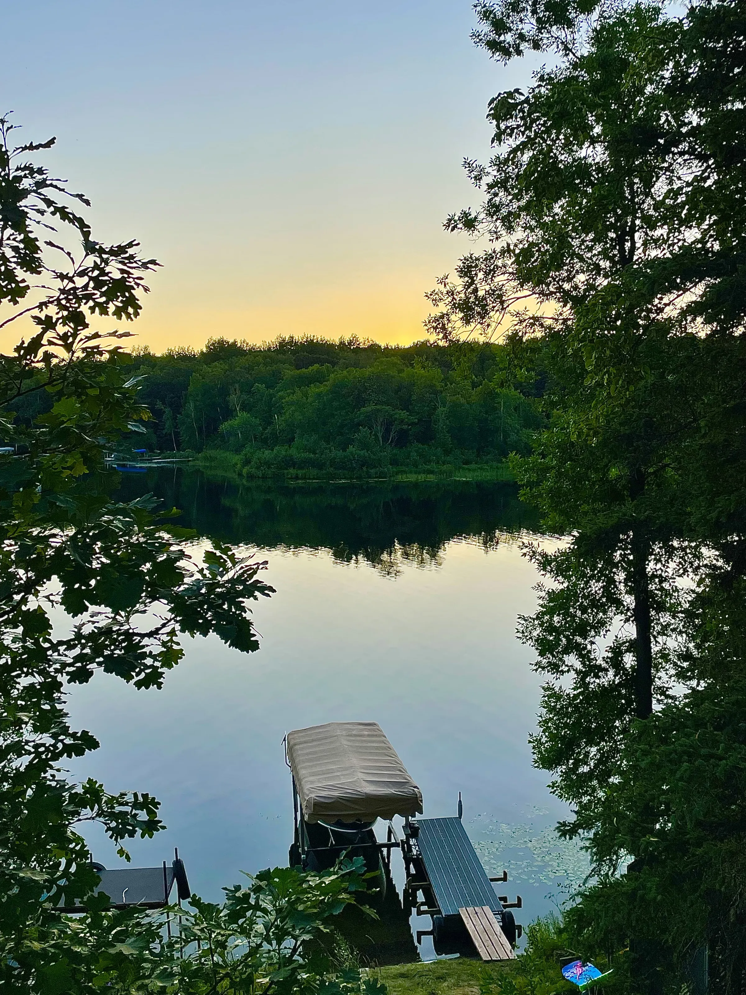Minnesota lake photo of sunset on forest of a dock