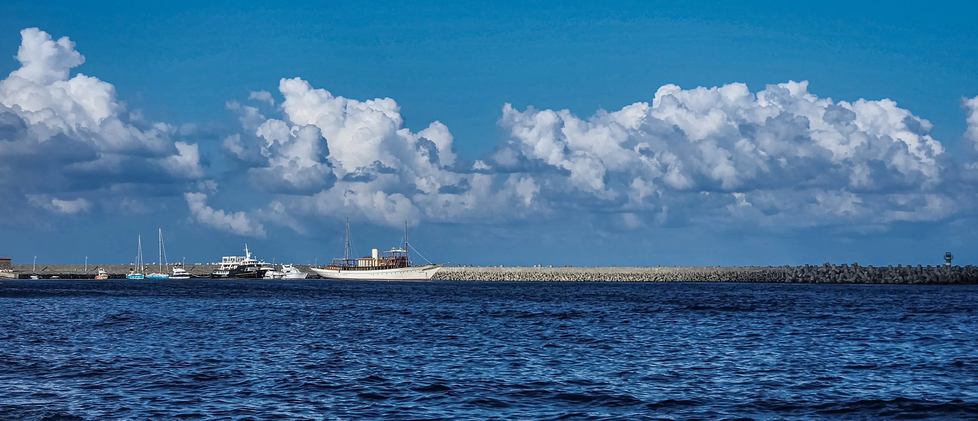 Sea, boats and clouds